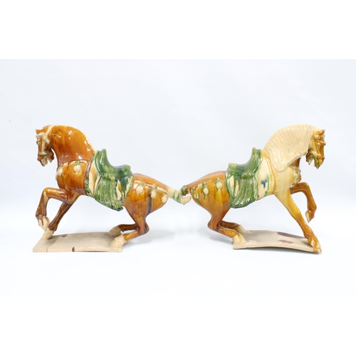 370 - A pair of Tang style terracotta horses, 40 x 53cm (2)