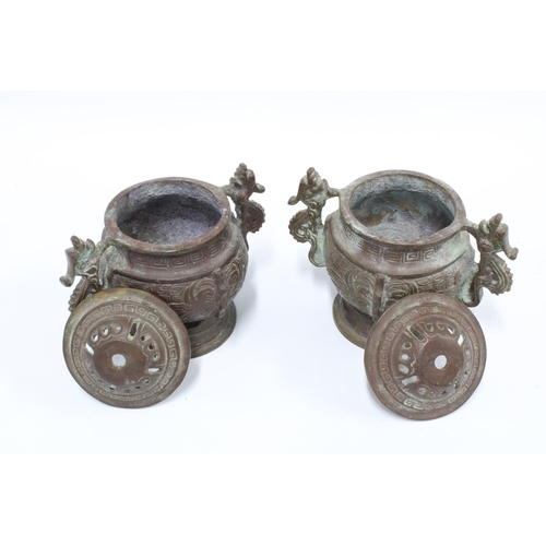 373 - A pair of Chinese archaic style bronze censors, twin handled with pierced covers, 14cm (2)