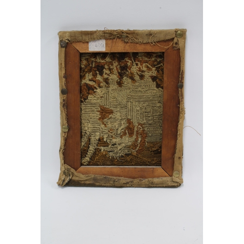 403 - A small antique tapestry of a Spaniel under a tree, tacked on a stretcher, 31 x 25cm