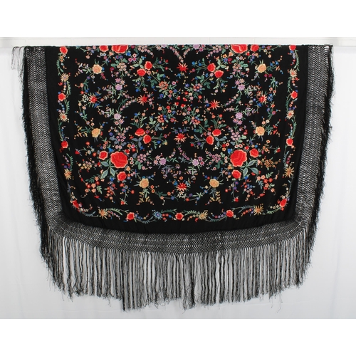 409 - Chinoiserie embroidered Manila / piano shawl, the silk black ground with floral embroidery, 132 x 12... 