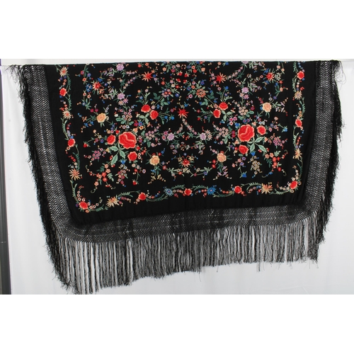 409 - Chinoiserie embroidered Manila / piano shawl, the silk black ground with floral embroidery, 132 x 12... 