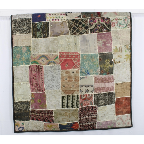 410 - Patchwork quilt, with some crewelwork and embroidered panels, and mirror applique, 155 x 100cm