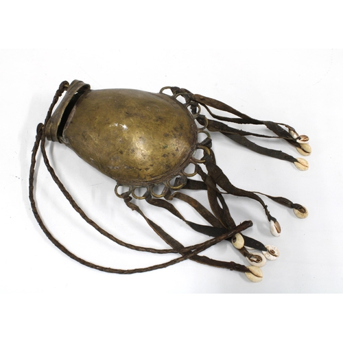 412 - African bronze container with cowrie shell tassels, 19cm