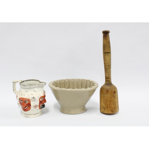 423 - Stoneware jelly mould, 11cm, together with a wooden kitchen mallet and a Staffordshire mask head jug... 