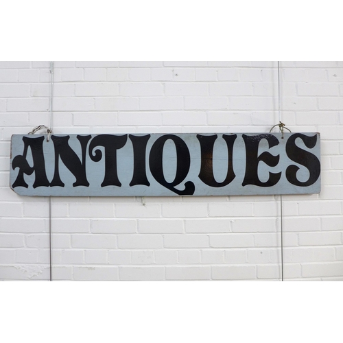 454 - Handpainted 'Antiques' sign, 152 x 30cm.