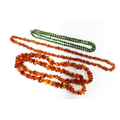 6 - Two strands of amber beads and a double strand of jade beads, (3)