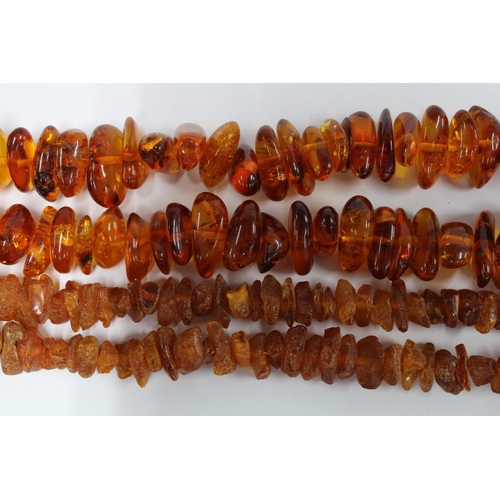 6 - Two strands of amber beads and a double strand of jade beads, (3)