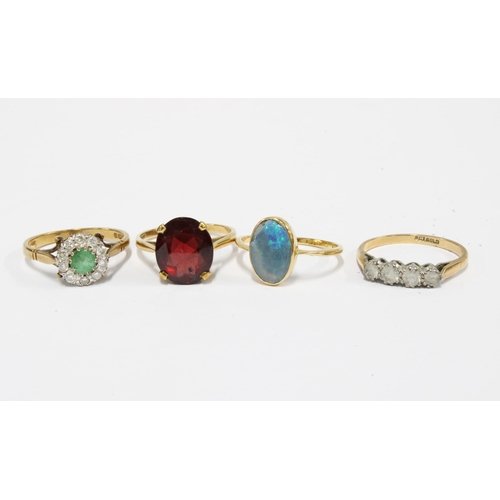 62 - A group of four 9ct gold gemset & paste  rings (4)