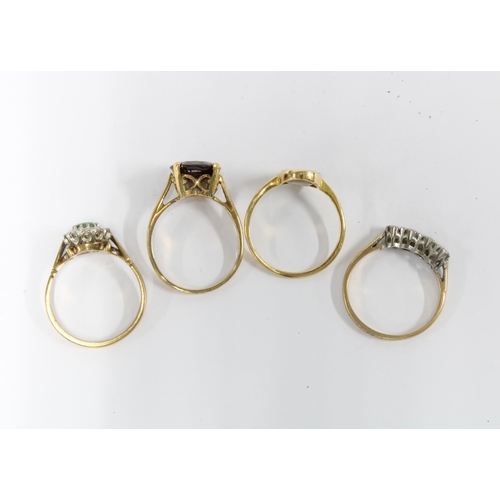 62 - A group of four 9ct gold gemset & paste  rings (4)