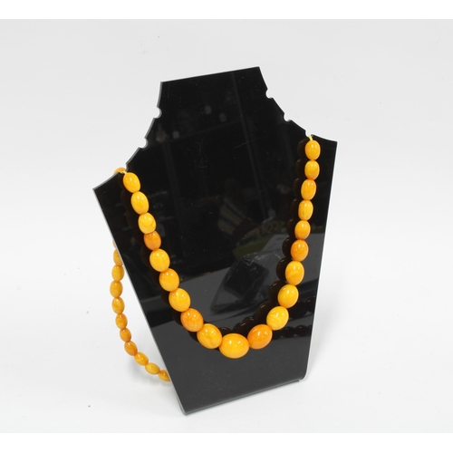 70 - Two strands of faux amber beads (2)