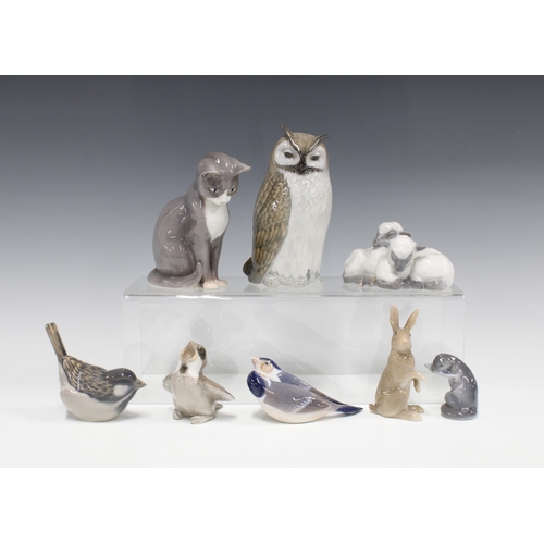 82 - A group of eight Royal Copenhagen porcelain birds and animals to include an Owl, Cat, Hare and an Ot... 