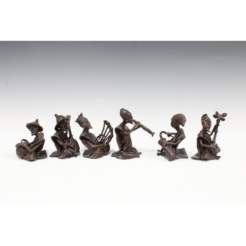 321 - An African bronze patinated metal band, with six musicians, tallest 9cm  (6)