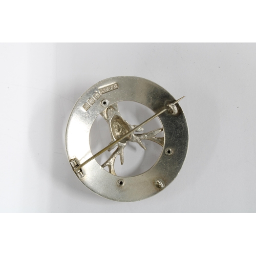12 - William Dunningham & Co silver stag head brooch, Edinburgh 1948 and a silver kilt pin, Edinburgh 195... 