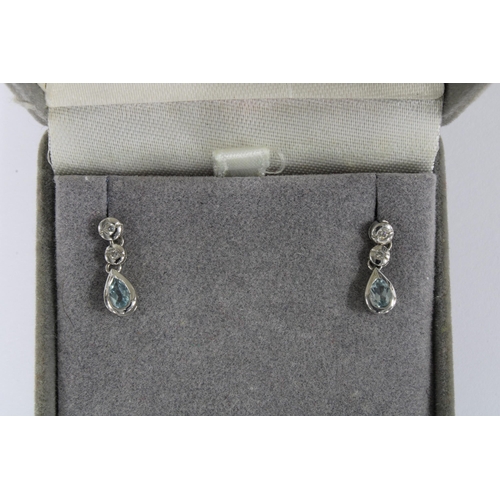22 - A pair of 18ct white gold diamond and aquamarine drop earrings, stamped 750