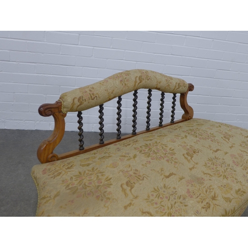 224 - Victorian low settee, upholstered scroll back and seat with spiral splats, 138 x 70 x 59cm.