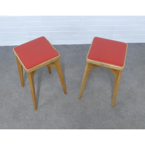 231 - A pair of two  mid-century design stools by Benchairs, light oak with  red vinyl seats, 31 x 58cm. (... 