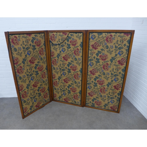 247 - Mahogany three fold screen with floral upholstered panels, 218 x 153cm.