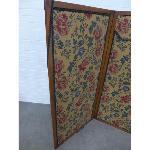 247 - Mahogany three fold screen with floral upholstered panels, 218 x 153cm.