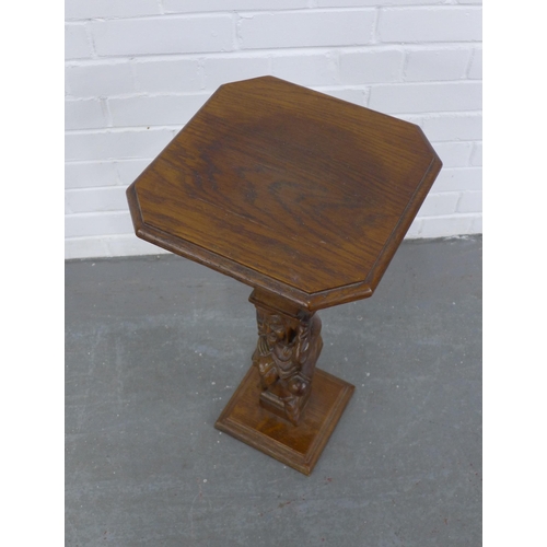 249 - Carved oak and fruitwood table/stand, on a  Jester figural column, 32 x 64cm.