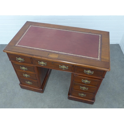 285 - Mahogany pedestal desk, rectangular top with red skiver, over an arrangement of nine drawers with br... 