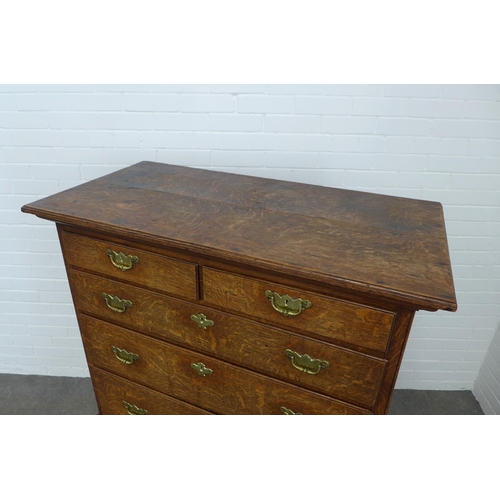 286 - An oak chest on stand, the top with two short and three graduating long drawers, the base with three... 