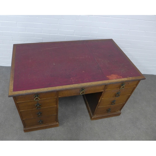 292 - An early 20th century oak desk, 129 x 76 x 78cm.