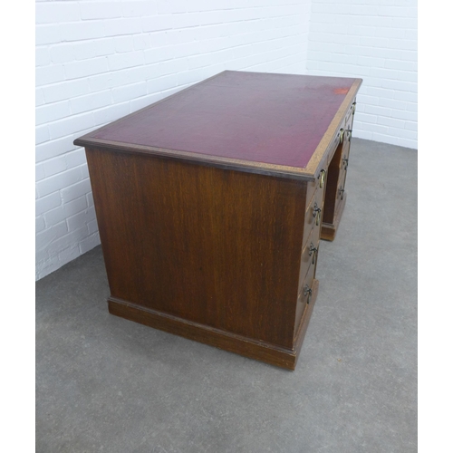 292 - An early 20th century oak desk, 129 x 76 x 78cm.