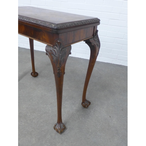 299 - Mahogany foldover card table, on acanthus carved cabriole legs ending on claw and ball feet, 79 x 74... 