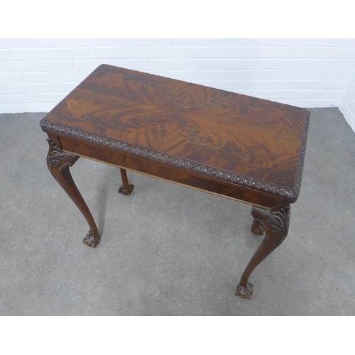 299 - Mahogany foldover card table, on acanthus carved cabriole legs ending on claw and ball feet, 79 x 74... 