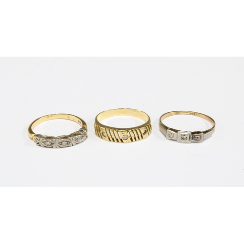 34 - Two 18ct gold dress rings and a yellow metal ring (3)
