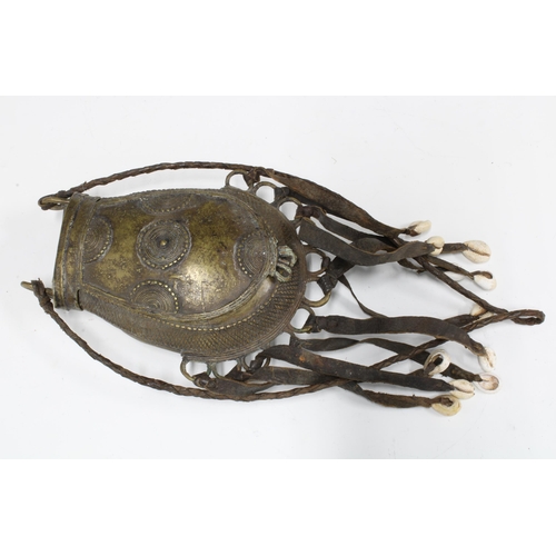 384 - African bronze container with cowrie shell tassels, 19cm