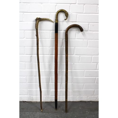 397 - Brass elephant handled walking stick, 94cm, together with a horn handled walking stick, 87cm, and an... 