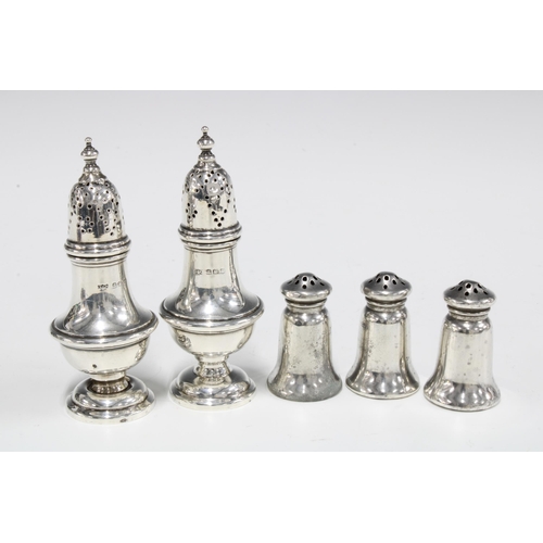 4 - Three Sterling silver pepper pots by The Gorham Co, Fifth Avenue, New York, 4cm high and a pair of G... 