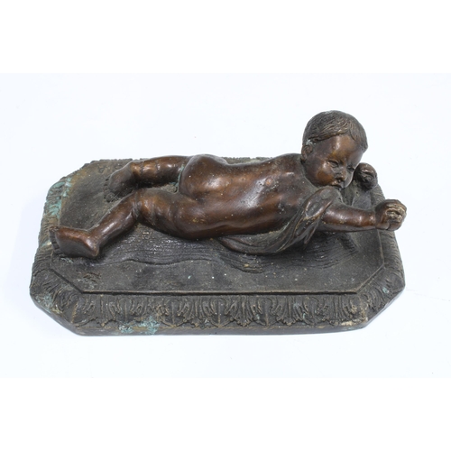 413 - After Della Robbia, a bronze figure of a crawling baby, on a rectangular base with acanthus border, ... 