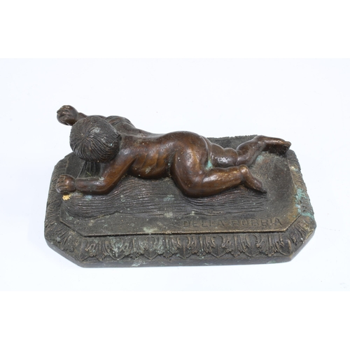 413 - After Della Robbia, a bronze figure of a crawling baby, on a rectangular base with acanthus border, ... 