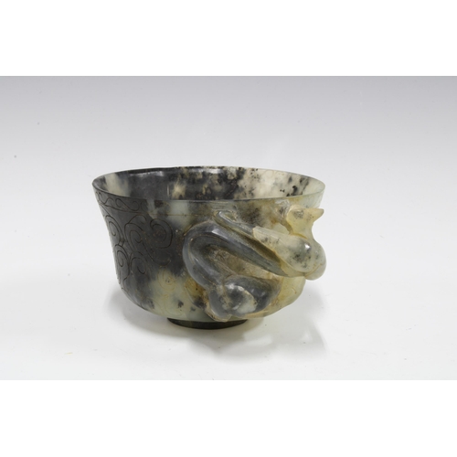 420 - Chinese carved hardstone cup with a dragon handle, standing on a plain circular footrim, 12cm diamet... 