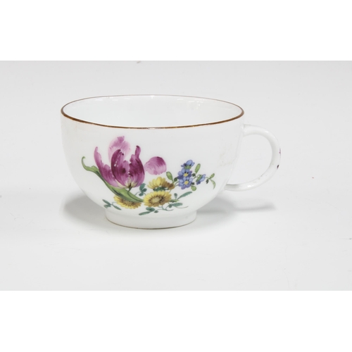 425 - A Meissen floral decorated porcelain teacup, blue crossed swords mark