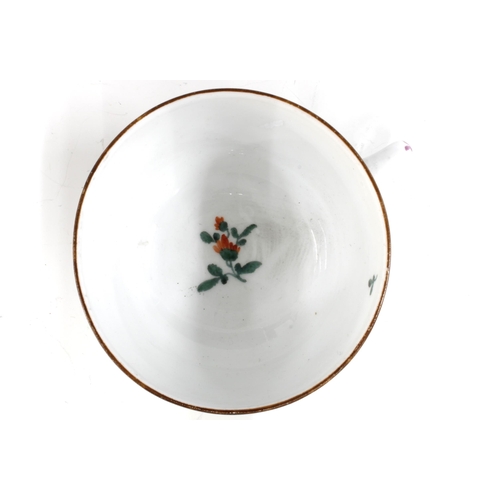 425 - A Meissen floral decorated porcelain teacup, blue crossed swords mark