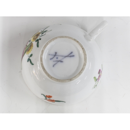 425 - A Meissen floral decorated porcelain teacup, blue crossed swords mark