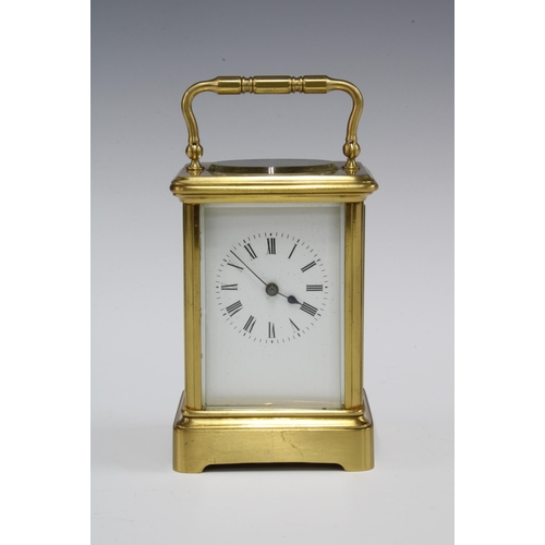 434 - A small brass and glass panelled carriage clock (one glass side panel lacking) , full striking, with... 