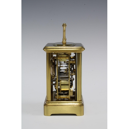 434 - A small brass and glass panelled carriage clock (one glass side panel lacking) , full striking, with... 