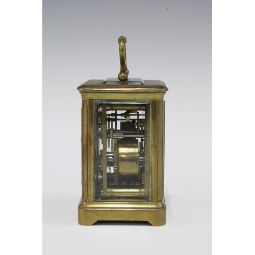 435 - Miniature brass and glass cased  alarm carriage clock, with key 9.5cm including handle