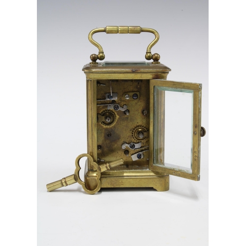 435 - Miniature brass and glass cased  alarm carriage clock, with key 9.5cm including handle