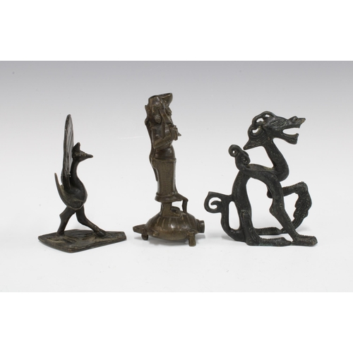 438 - Three Indian bronze figures to include a deity and a peacock, etc , tallest 12cm (3)