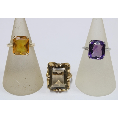 55 - 9ct gold smoky quartz ring, 14ct gold citrine ring and a white metal gemset dress ring with indistin... 