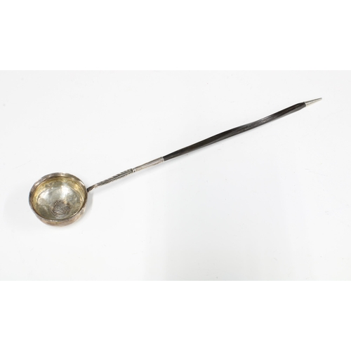 59 - Georgian unmarked white metal toddy ladle, the bowl inset with a coin, baleen handle, 39cm long