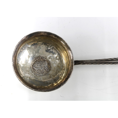 59 - Georgian unmarked white metal toddy ladle, the bowl inset with a coin, baleen handle, 39cm long