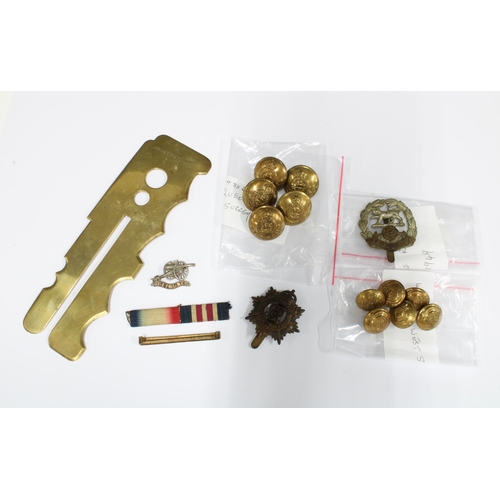 8 - A collection of military items to include buttons, badges and a War Department brass button stick, e... 