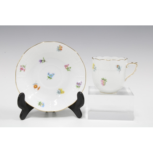97 - Three Herend floral painted cups and saucers to include a Meissen style pattern of sliced fruit, etc... 