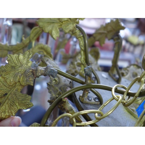 452 - Gilt metal eight branch chandelier, decorated in grape leaves, with glass drops, approximately 50 x ... 